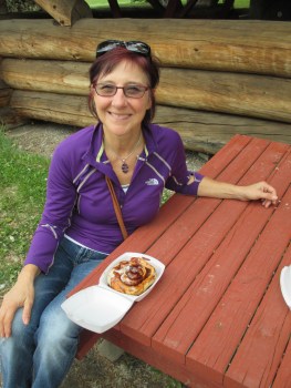 Enjoying a fresh homemade cinnamon bun warm out of the oven!